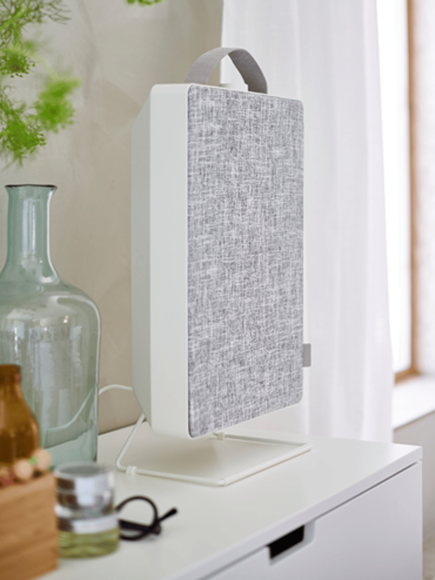 Air purifier on chest of drawers