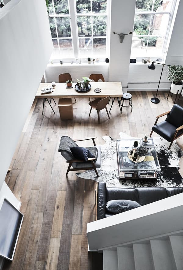 An aerial view of an open-plan living room, showing both seating and eating areas.