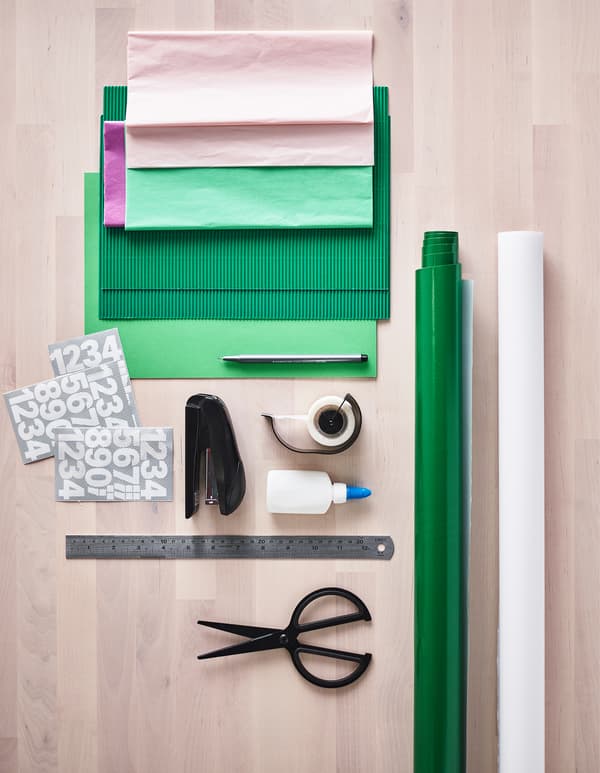 An aerial view of what you will need to make this advent calendar like paper, scissors, tape and glue.