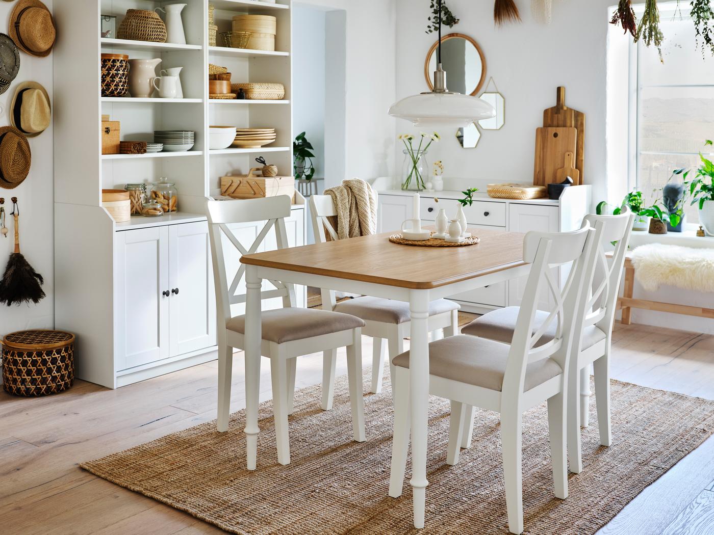 An airy, white dining area with natural-fibre accents, centred around a DANDERYD table, INGOLF chairs and a LOHALS rug.