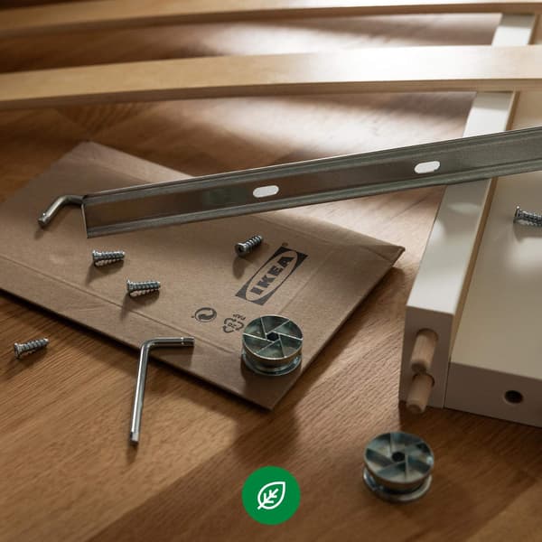 An assortment of IKEA screws and other objects that pertain to furniture assembly