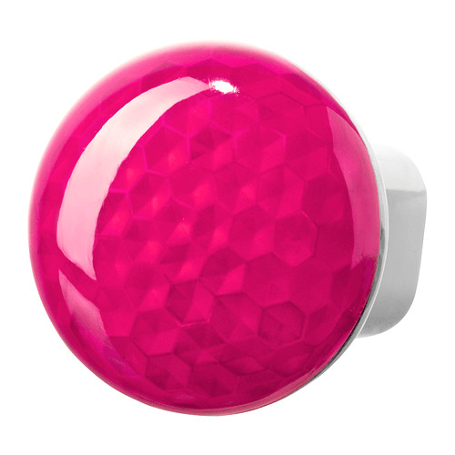 An close-up of a pink nightlight against a white background.