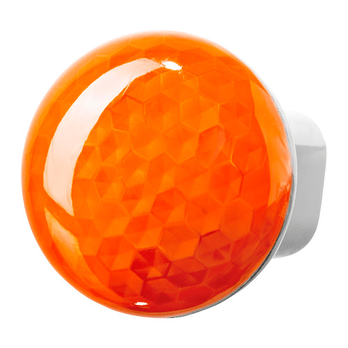 An close-up of an orange nightlight against a white background.