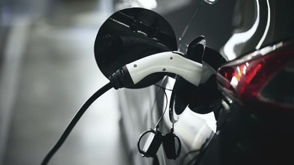 An electric car plugged into a charging station