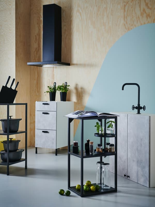 An ENHET shelving unit with drawer cabinet in background and sink unit on the side.