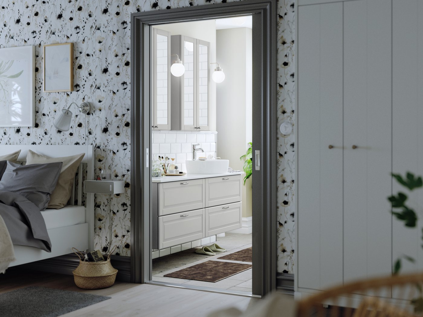 An ensuite bathroom with two GODMORGON wash-stands, each with two drawers holding a wash basin and toiletries.