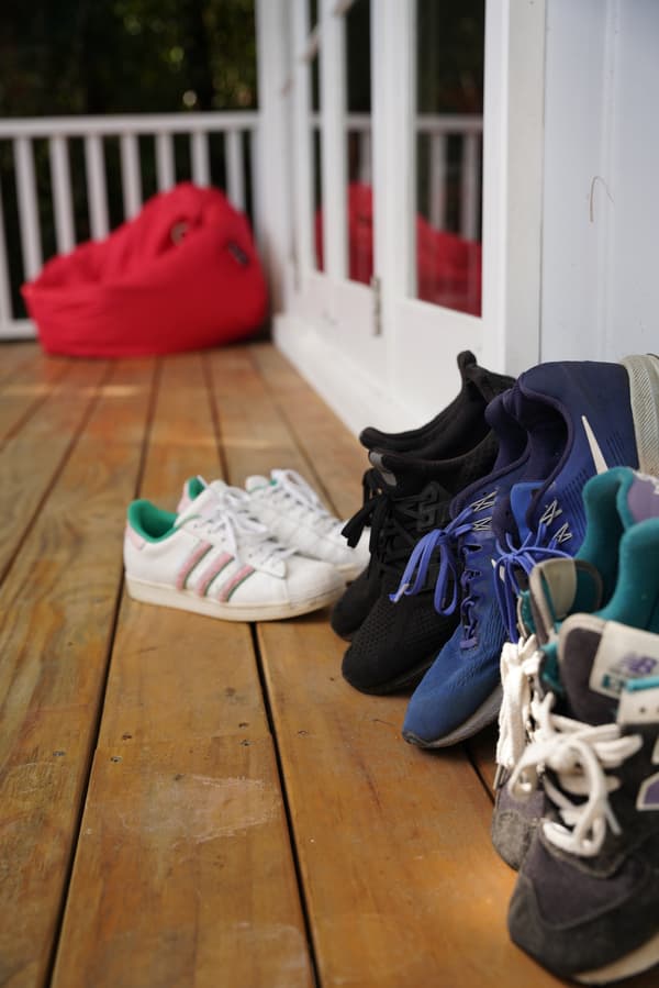 An entrance with shoes left outside.