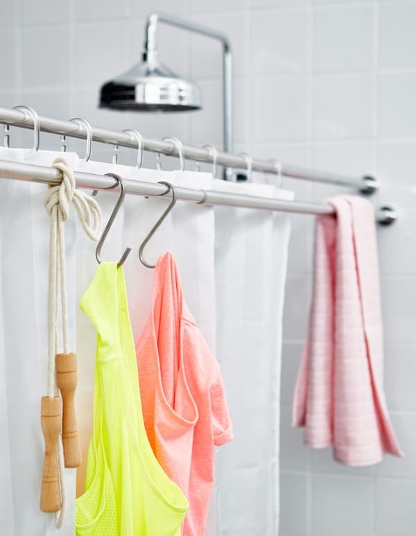 An extra shower rod, place by the shower, to dry towels and gym clothes.