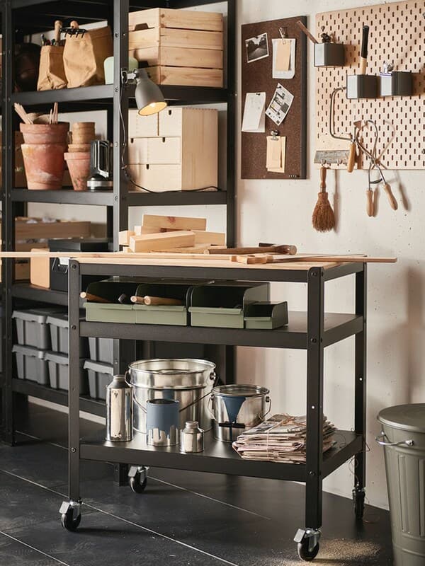 An IKEA BROR shelving unit on castors in the garage.