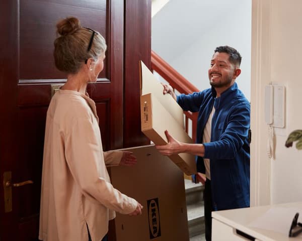 An IKEA coworker delivering an order