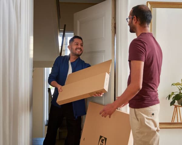 An IKEA coworker delivering an order