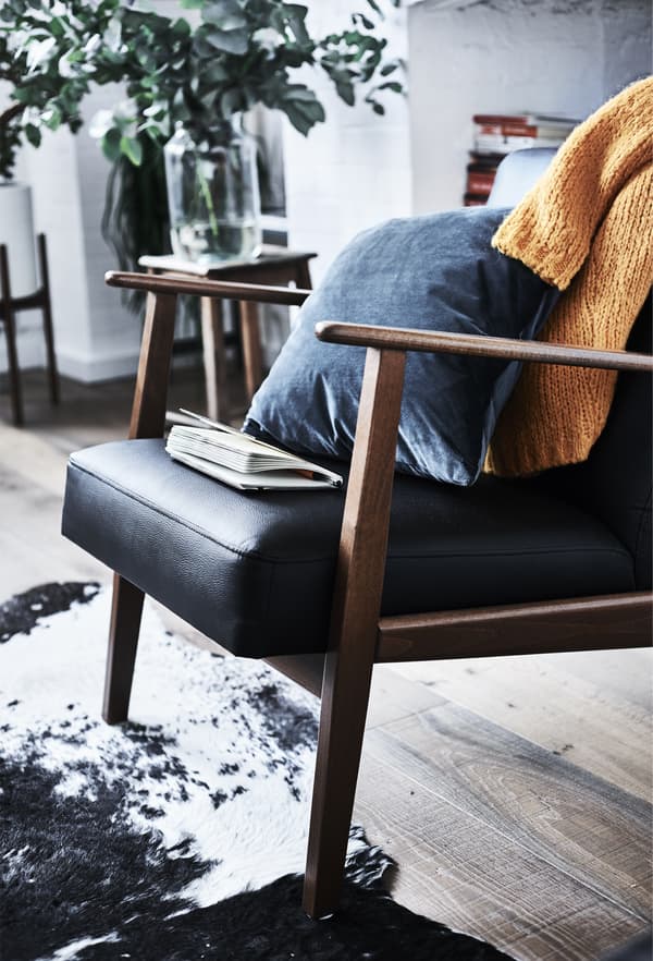 An IKEA EKENÄSET armchair.