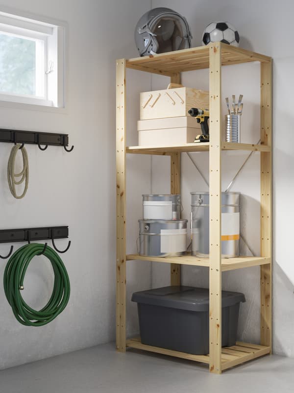 An IKEA HEJNE pine storage unit in the garage.