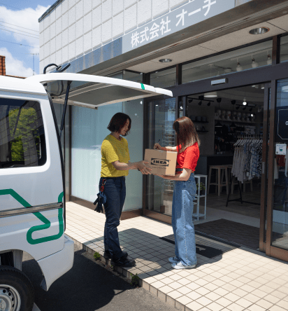 An IKEA worker delivering a package