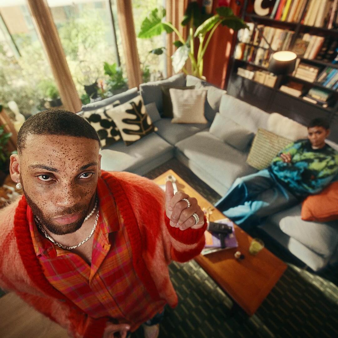 An image of a small, budget-friendly apartment for two with two people shown on the image.