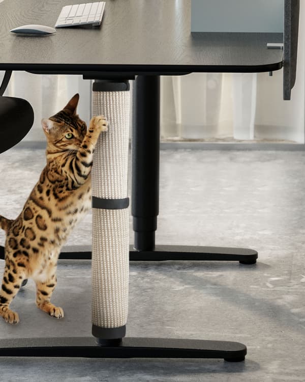 An in-situ image of the LURVIG scratching mat wrapped around a filing cabinet.