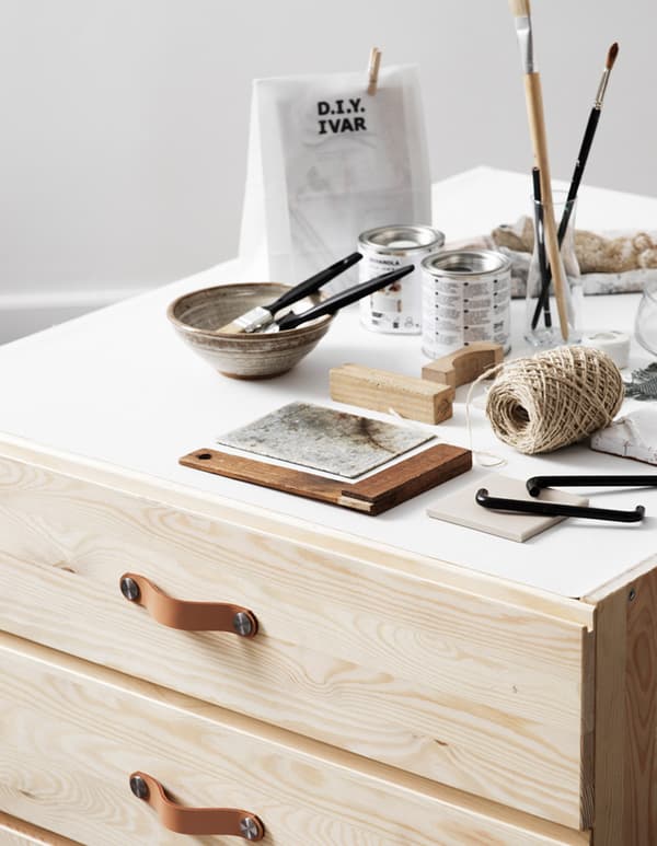 An IVAR chest of 3 drawers with art equipment on top.