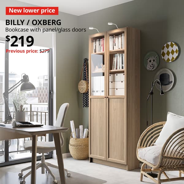 An oak effect BILLY with OXBERG panel with glass doors in a study room/home office setting with New lower price tag. Price: $219. Usual price with red slash: $279.