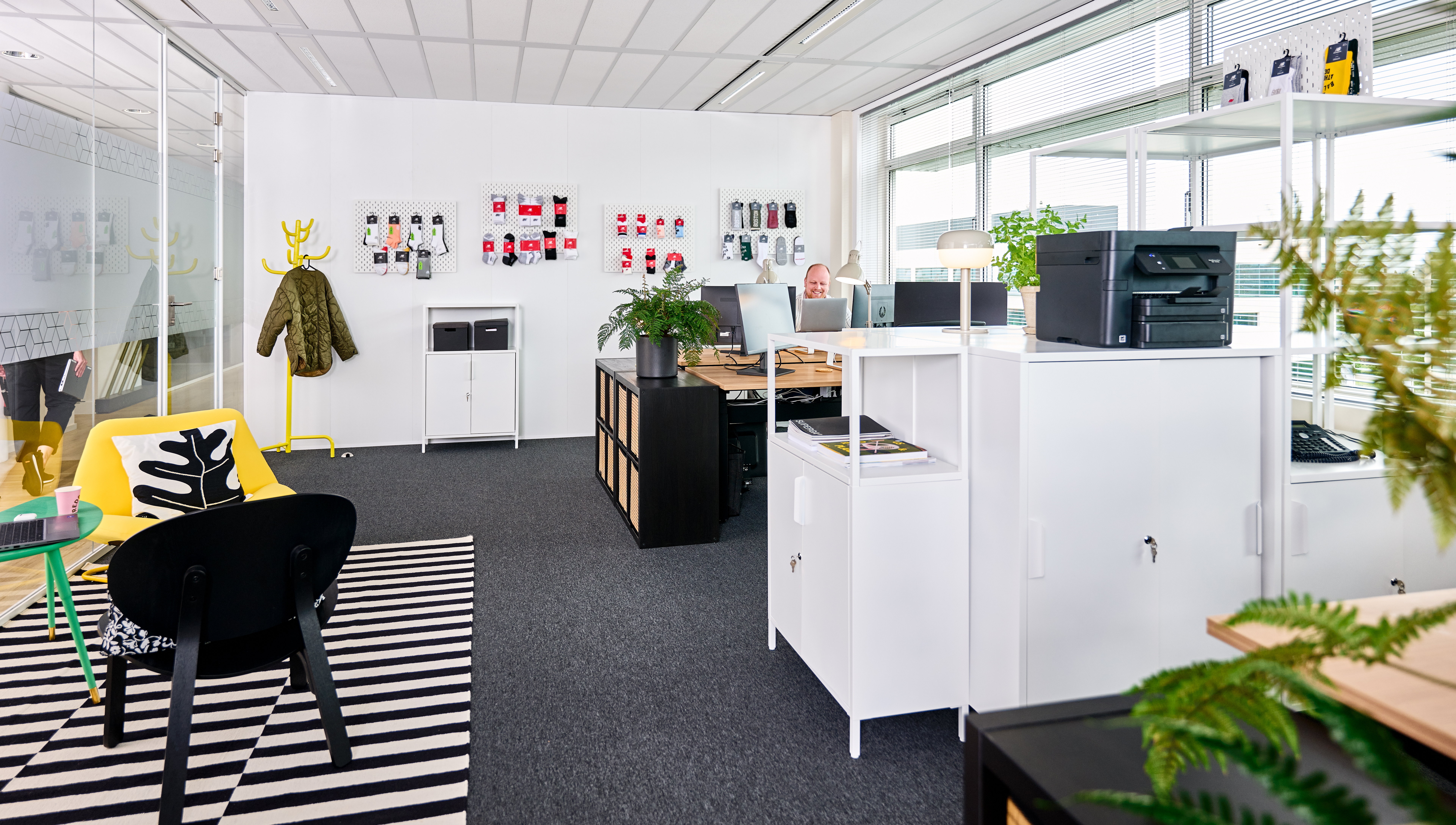 An office furnished with modern IKEA furniture.