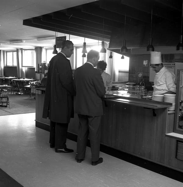 An old picture of an IKEA employee serving at IKEA restaurant 