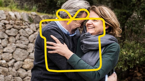 An older couple hugging each other