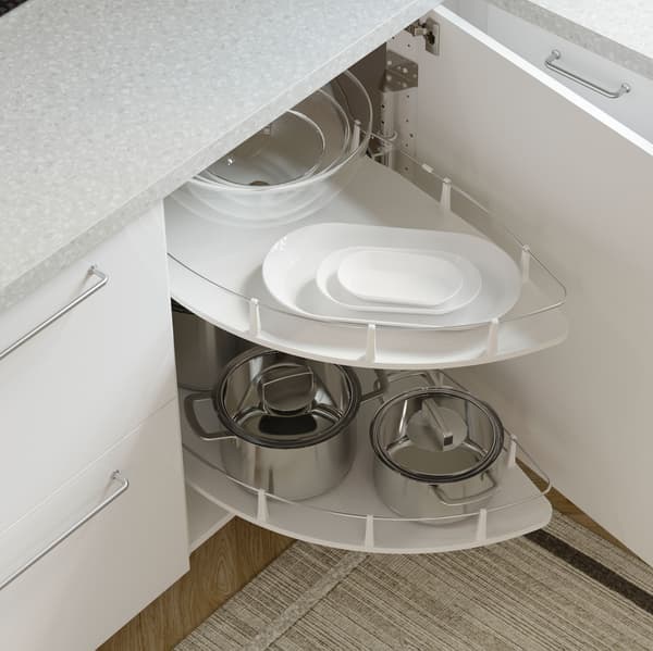 An open IKEA RINGHULT white kitchen cabinet front with a UTRUSTA carousel inside used for storing pots and pans.
