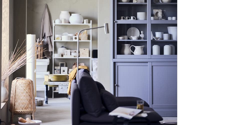 An open storage space with various storage shelving and cabinets.