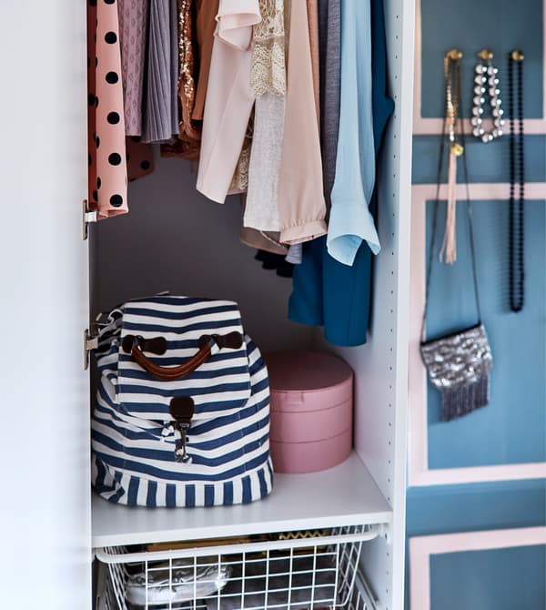 An open wardrobe showing the clothing and accessories stored inside.