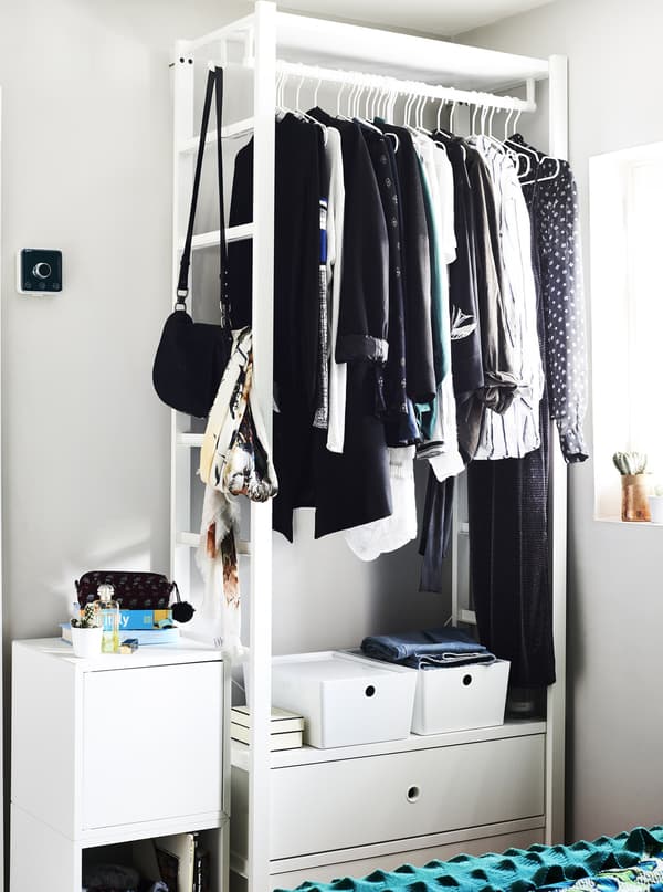 An open wardrobe system is ideal for a small bedroom.