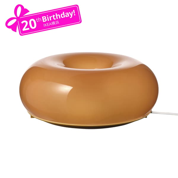 An orange glass/round VARMBLIXT LED table/wall lamp in the NA