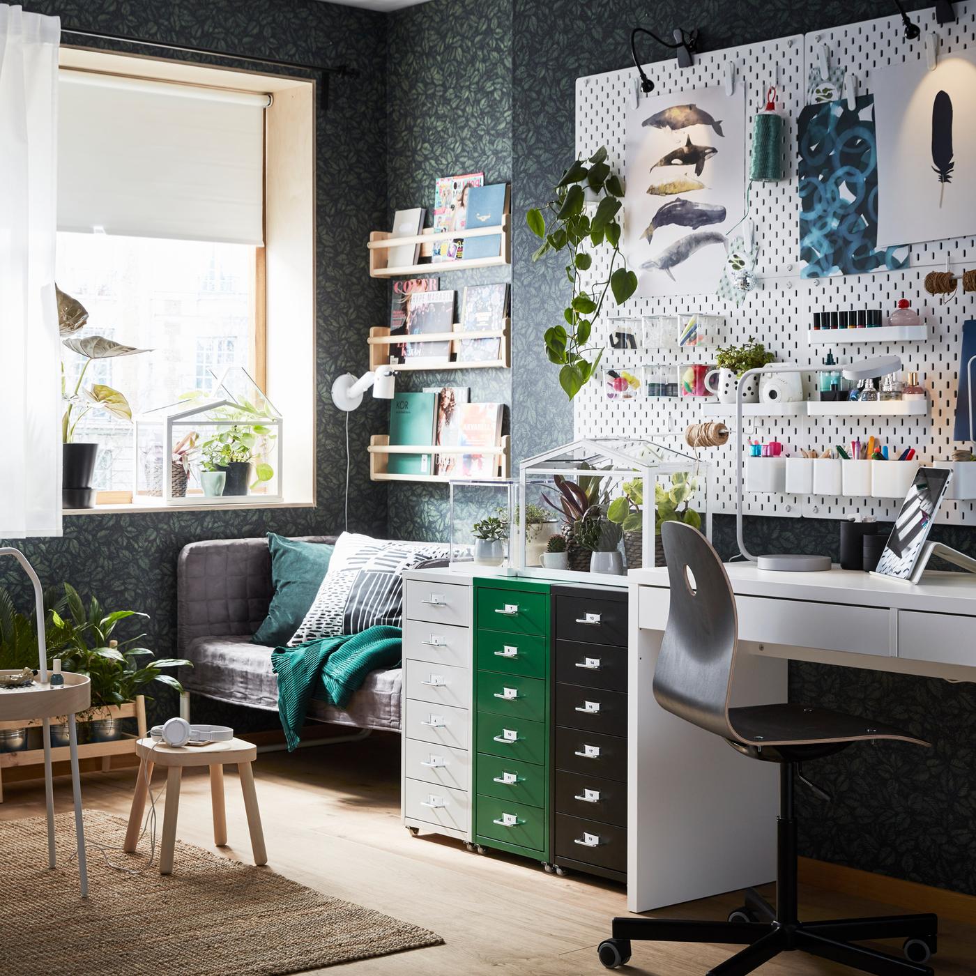 An organised home workspace with HELMER drawer units on castors in white, green and black.