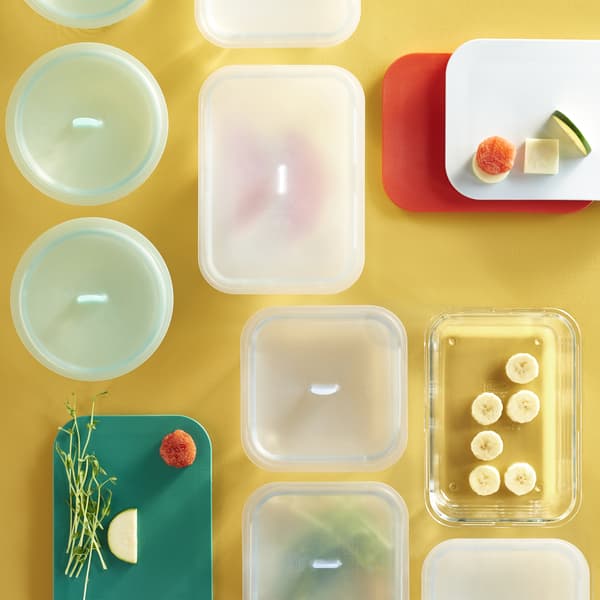 An overhead view of food storage boxes of different shapes and sizes with lids.