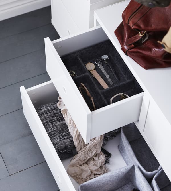 An overhead view of opened drawers in a hall organization solution.