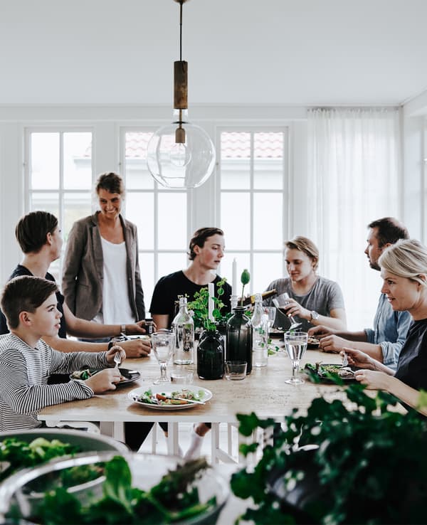 Annika’s friends and family gather around the table