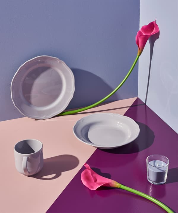 ARV deep plates in an artful mix with flowers and color.