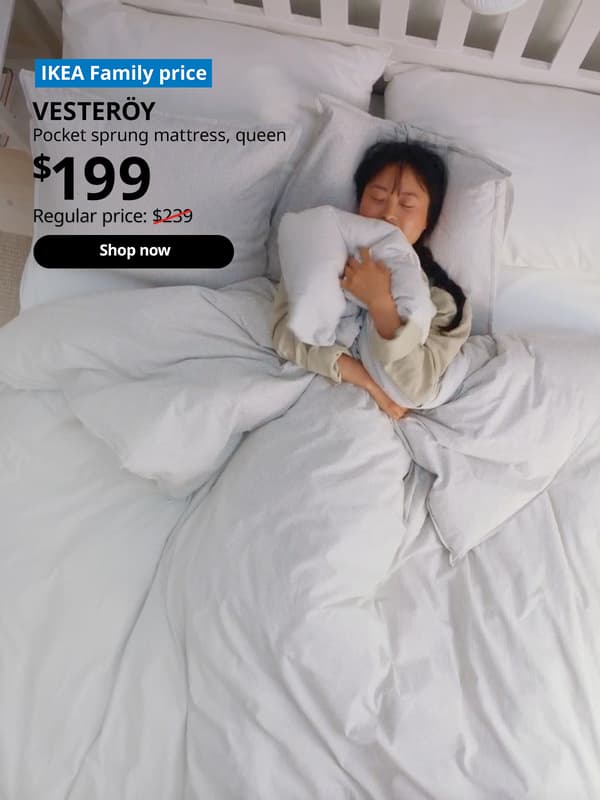 Asian woman in pajamas sleeping on bed hugging duvet cover. VESTERÖY pocket sprung mattress, firm, $199. Regular price: $239. Shop now.