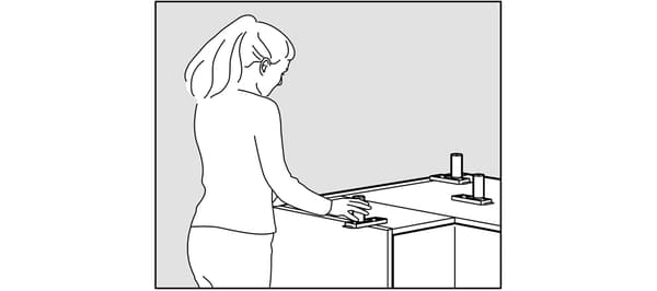Assembly of IKEA kitchen cabinets.