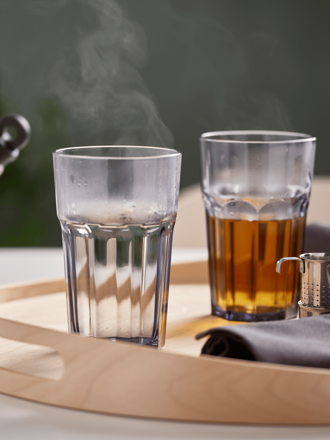 Assorted glassware with steam rising from hot beverages on a wooden tray – Glassware from ₹99