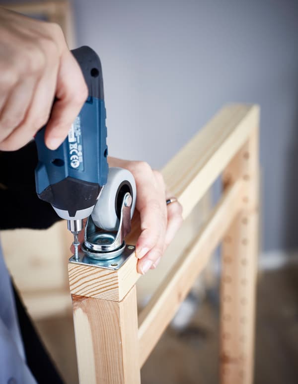 Attaching castors to the bottom of your IVAR shelf lets you move it easier.