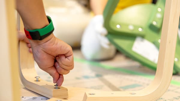 Attaching chair legs with screws.