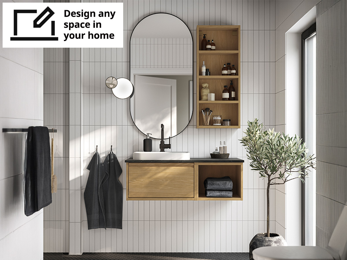 Bathroom with white subway tiles and oak effect ÄNGSJÖN bathroom system. 