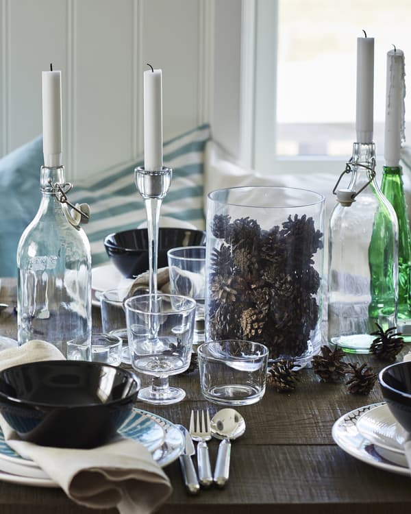  Be inspired by nature – cool winter shades and scattered pine cones help create the perfect seasonal table setting.
