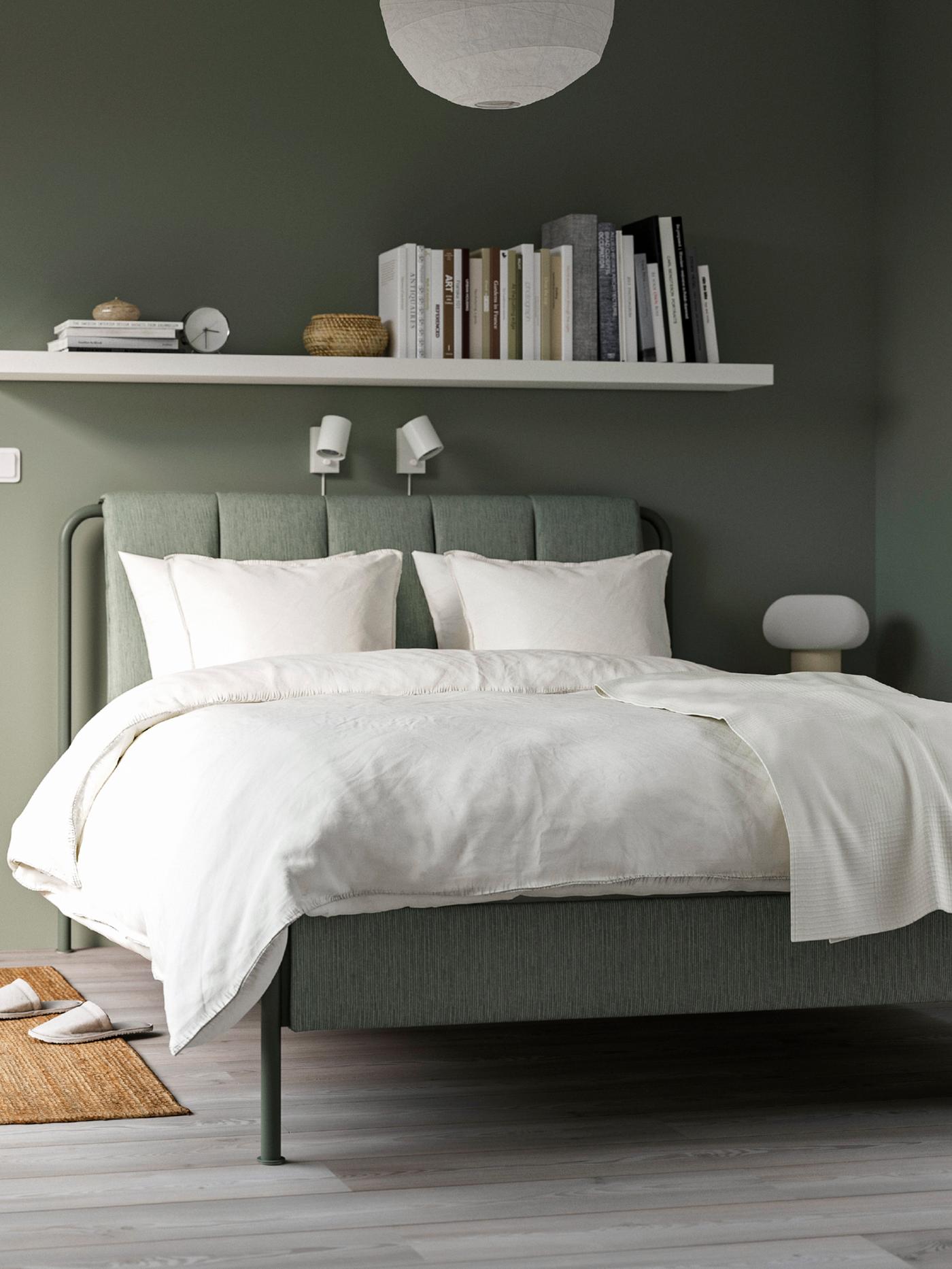 Bed frame and white bedding.