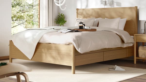 Bedroom featuring a bed on a bed frame complete with bed textiles