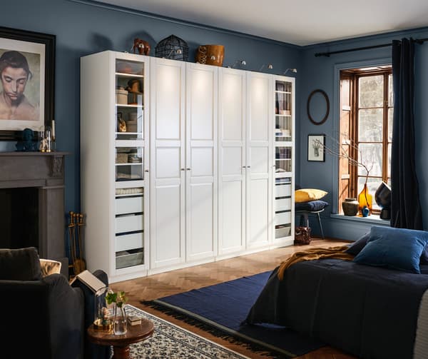 Bedroom showcasing a White PAX wardrobe with white Grimo doors