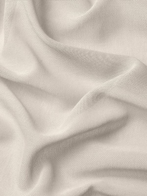 Beige curtain fabric close-up.
