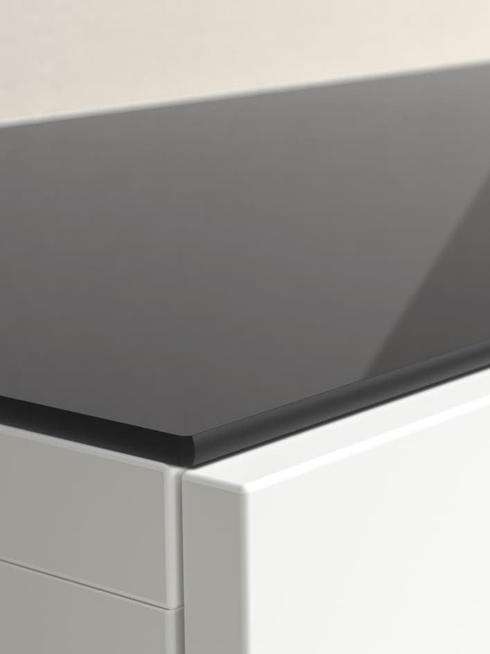 BESTÅ glass top panel in dark grey colour with white frame and doors. 