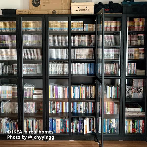 BILLY bookcase in black oak effect filled up the wall with books. IKEA in real homes Photo by @_chyyingg