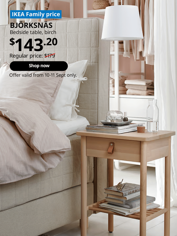 BJORKSNAS bedside table placed next to a beige bedframe with mattresses and pillows on top.  Words on image read "IKEA Family Price, BJORKSNAS, bedside table, birch, $143.20, Regular price, $179 with a slash, shop now, Offer valid from 10-11 Sept only"