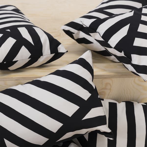 Black and white striped cushions on a wooden step.